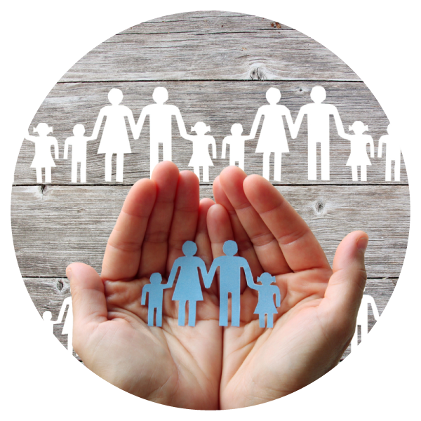 Hands holding paper people cut out